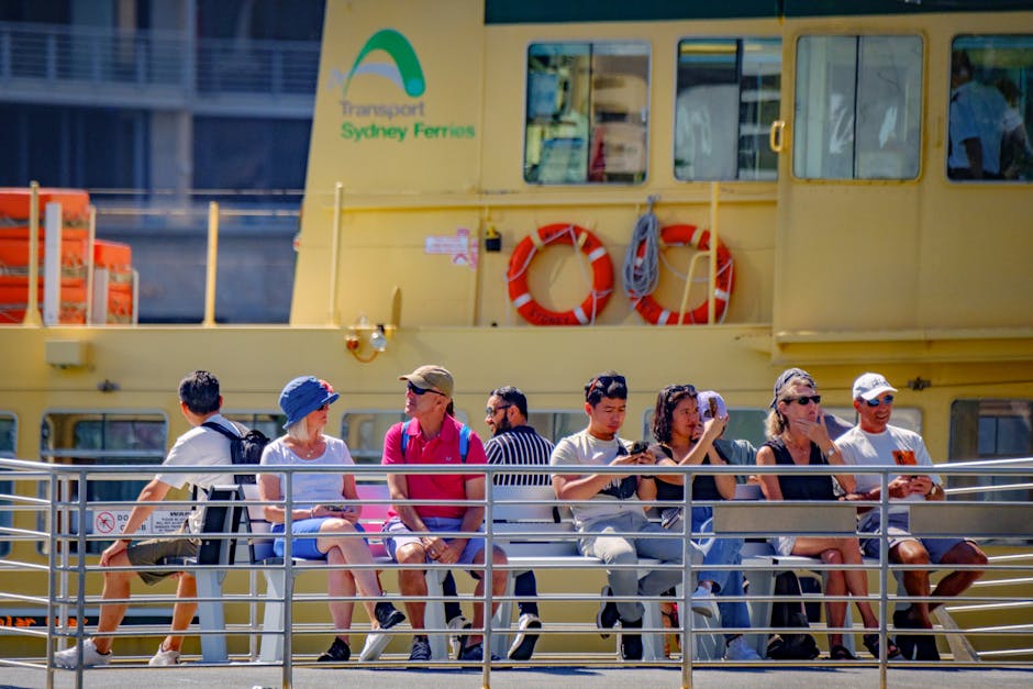 Passengers aboard Sydney Ferry enjoy a sunny day, showcasing leisure and travel.